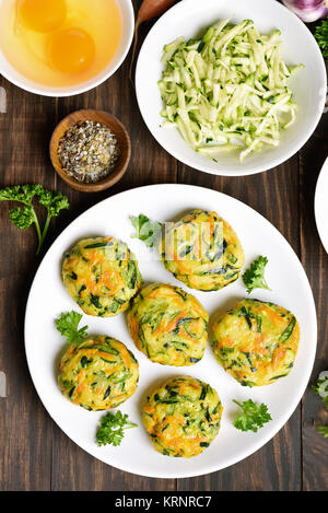 Healthy food. Diet vegetable cutlet from carrot, zucchini, potato on wooden table. Top view, flat lay food Stock Photo