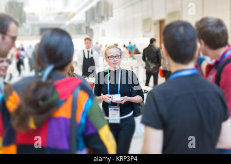 People interacting during coffee break at medical conference. Stock Photo