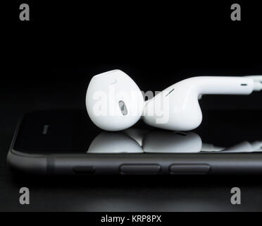 close-up headphone on phone black background Stock Photo