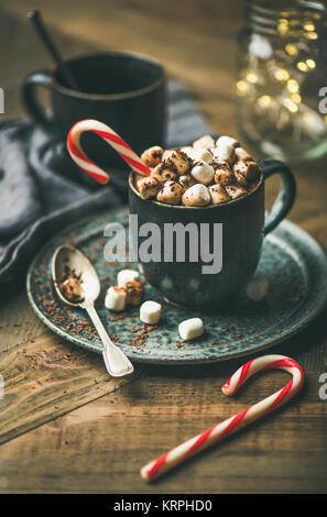 Christmas hot chocolate with marshmallows and cocoa on wooden background Stock Photo
