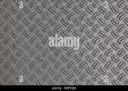 Dark gray industrial anti slip embossed metal steel plate with double diagonal bumps of diamond pattern texture, background, close up Stock Photo