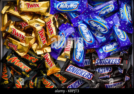 Tambov, Russian Federation - November 15, 2017 Snickers, Mars, Milky Way and Twix minis candy bars in the box. Full Frame. Studio shot. Stock Photo