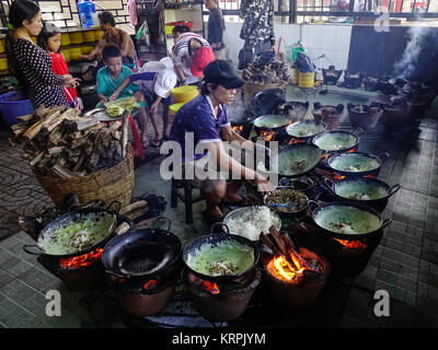 Mekong Delta, Vietnam - Sep 2, 2017. A man cooking traditional pancake at local restaurant in Mekong Delta, Vietnam. Stock Photo