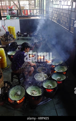 Mekong Delta, Vietnam - Sep 2, 2017. A man cooking traditional pancake at local restaurant in An Giang, Mekong Delta, Vietnam. Stock Photo