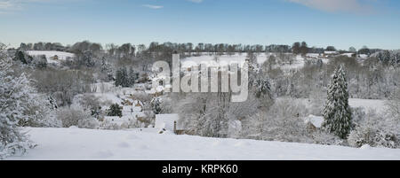 Chedworth village in the december snow. Chedworth, Cotswolds, Gloucestershire, England. Panoramic Stock Photo