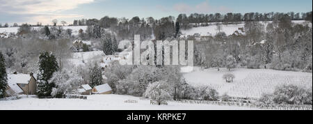 Chedworth village in the december snow. Chedworth, Cotswolds, Gloucestershire, England. Panoramic Stock Photo