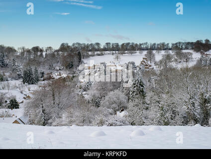 Chedworth village in the december snow. Chedworth, Cotswolds, Gloucestershire, England Stock Photo