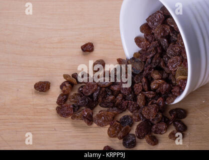 Dark raisins on a table Stock Photo