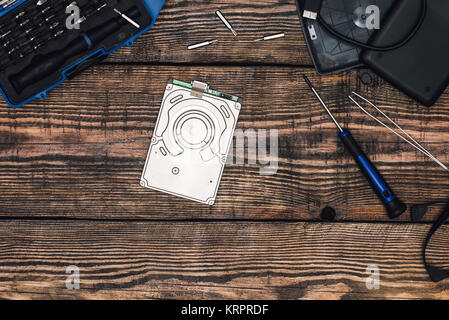 HDD with Screwdriver and Other Tools Stock Photo