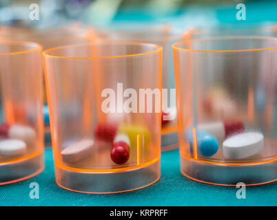 Daily medication at a hospital table, conceptual image Stock Photo