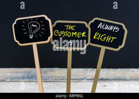 Concept message THE CUSTOMER IS ALWAYS RIGHT and light bulb as symbol for idea Stock Photo