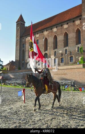 Gniew Castle, one of the most recognizable landmarks in Pomerania, Poland. Pictured: knight in the castle courtyard. Stock Photo