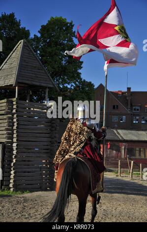 Gniew Castle, one of the most recognizable landmarks in Pomerania, Poland. Pictured: knight in the castle courtyard. Stock Photo