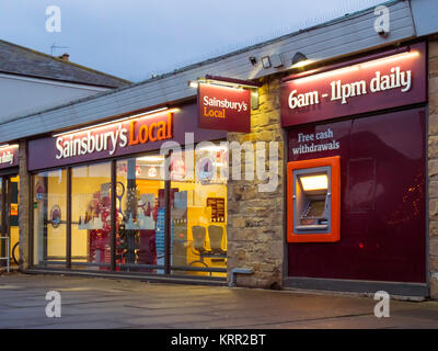 A village Sainsbury's Local supermarket convenience store in evening light in winter Stock Photo