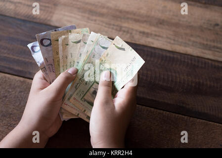 hand counting saudi riyal bank notes. financial concept Stock Photo