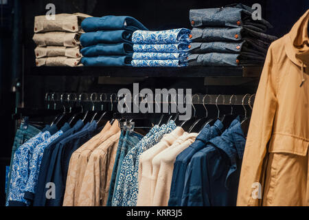 Detail of a clothing mannequin in a men suit shop with a white