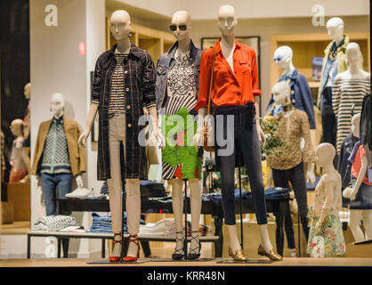 Fancy clothing on mannequins in a store in London. Stock Photo