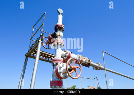 Oil well wellhead equipment. Hand valve with handwheel for opening and closing the flow line. Stock Photo