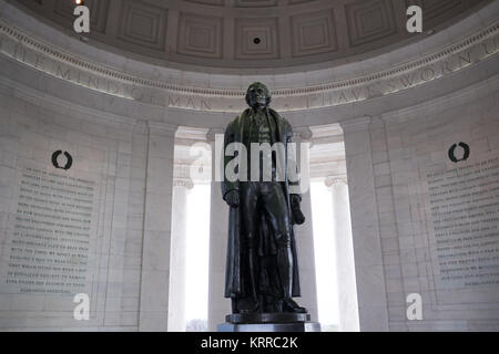 WASHINGTON DC - A statue of Thomas Jefferson by Rudulph Evans is the centerpiece of the Jefferson Memorial in Washington DC. It sits in the middle of the memorial under a large rotunda roof.