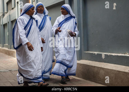 Missionaries of Charity sisters and nuns walking outside the Mother's House in Kolkata, India Stock Photo