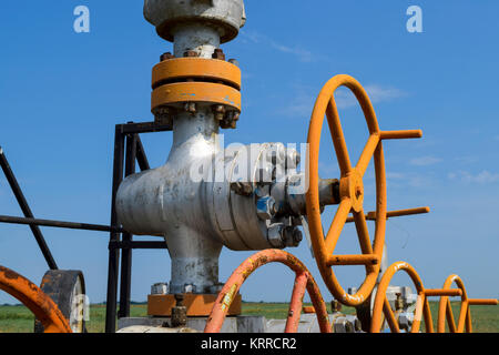 Oil well wellhead equipment. Hand valve with handwheel for opening and closing the flow line. Stock Photo