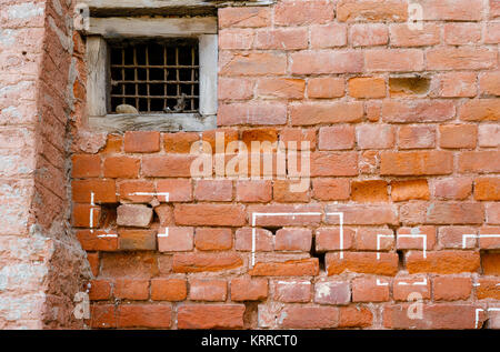 Bullet holes in a brick wall, Jallianwala Bagh, a public garden in Amritsar, Punjab, India, a memorial commemorating the 1919 Jallianwala Bagh Massacr Stock Photo