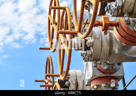 Oil well wellhead equipment. Hand valve with handwheel for opening and closing the flow line. Stock Photo