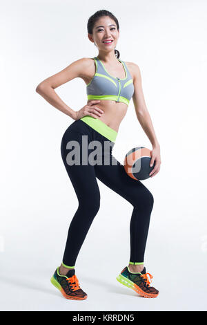 Young female athlete holding a volleyball Stock Photo