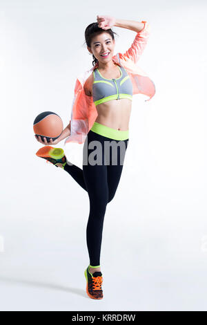 Young female athlete holding a volleyball Stock Photo