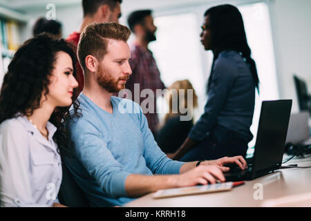 Software engineers working on project and programming in company Stock Photo