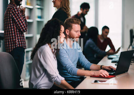 Software engineers working on project and programming in company Stock Photo