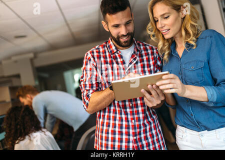 Portrait of software engineers using digital tablet Stock Photo