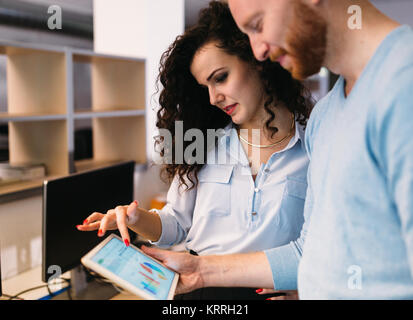 Software engineers using digital tablet in office Stock Photo