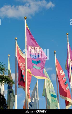 Festive multicolored flags fluttering in wind at Bayside in Miami, Florida, USA. Stock Photo