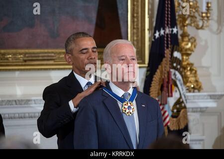 U.S. President Barack Obama presents U.S. Vice President Joe Biden with the Presidential Medal of Freedom at the White House State Dining Room January 12, 2017 in Washington, DC.
