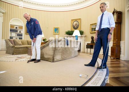 Actor Bill Murray and U.S. President Barack Obama play putt putt golf in the White House Oval Office October 21, 2016 in Washington, DC. Stock Photo