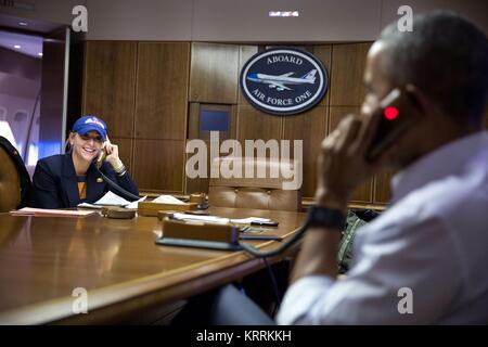 U.S. White House Deputy Chief of Staff Anita Decker listens on as U.S. President Barack Obama calls Chicago Cubs Manager Joe Maddon to congratulate him on the teams World Series win aboard Air Force One November 3, 2016. Stock Photo