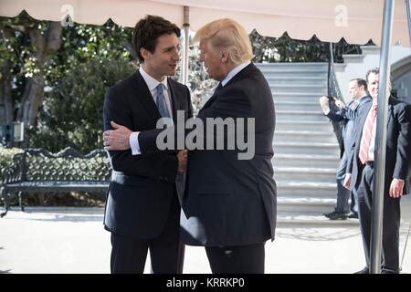 Canadian Prime Minister Justin Trudeau (left) greets U.S. President Donald Trump at the White House South Portico February 13, 2017 in Washington, DC.