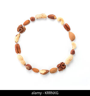 Pattern of nuts in circle form isolated on whie Stock Photo