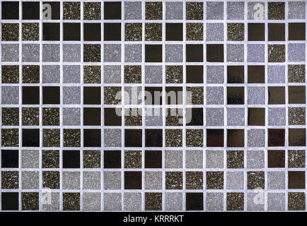 Part of the wall, lined with small mosaic tiles for use as a seamless backgrounds. Stock Photo