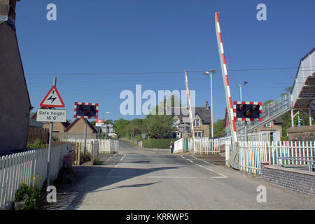 level crossing Cardross Scotland barriers open blue sky sunny day Stock Photo