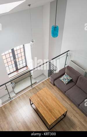 Top view of a mezzanine living room with table and couch Stock Photo