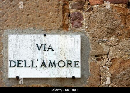 Street of love sign on a wall in Pienza, Italy Stock Photo