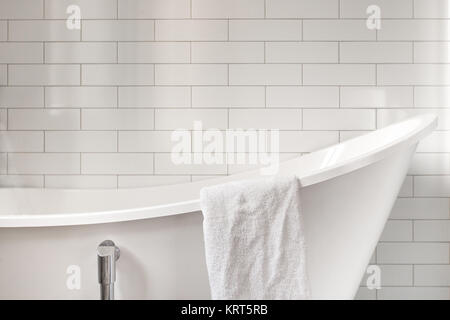 Towel on classic bathroom with old bathtub Stock Photo