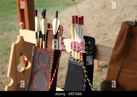 Colored feathers for arrows in a quiver Stock Photo