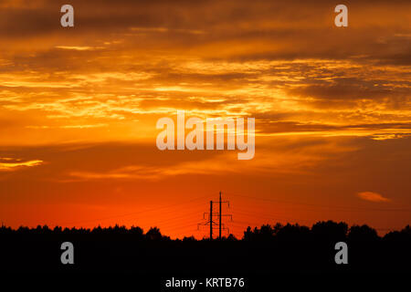 Bright vibrant orange and yellow colors sunset sky Stock Photo