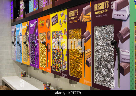 Miniature Hershey's candies waiting to be dispensed in the brand new Hershey Store in Times Square in New York on Tuesday, December 19, 2017. The spanking brand new store is three times larger than their previous space, three times as much chocolate goodness. (© Richard B. Levine) Stock Photo