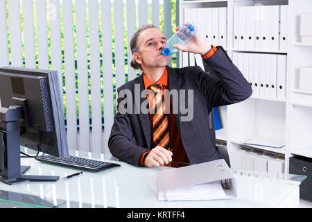 young business man drinking water Stock Photo