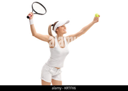 Female tennis player serving isolated on white background Stock Photo