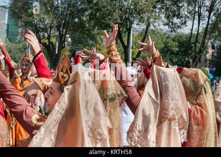 A group of young Armenian women in their traditional costumes dance during Yerevan´s anniversary celebrations. Stock Photo